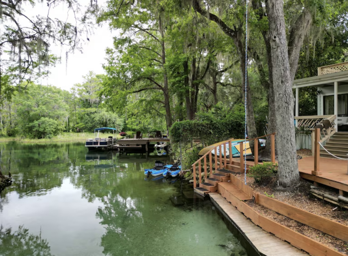 Wooden walkway over crystal clear spring water